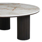 Round marble table with a white and brown pattern on a white background