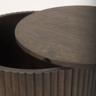 Close-up showing the removable wooden lid slightly ajar on the dark mango wood Eleanor storage side table.