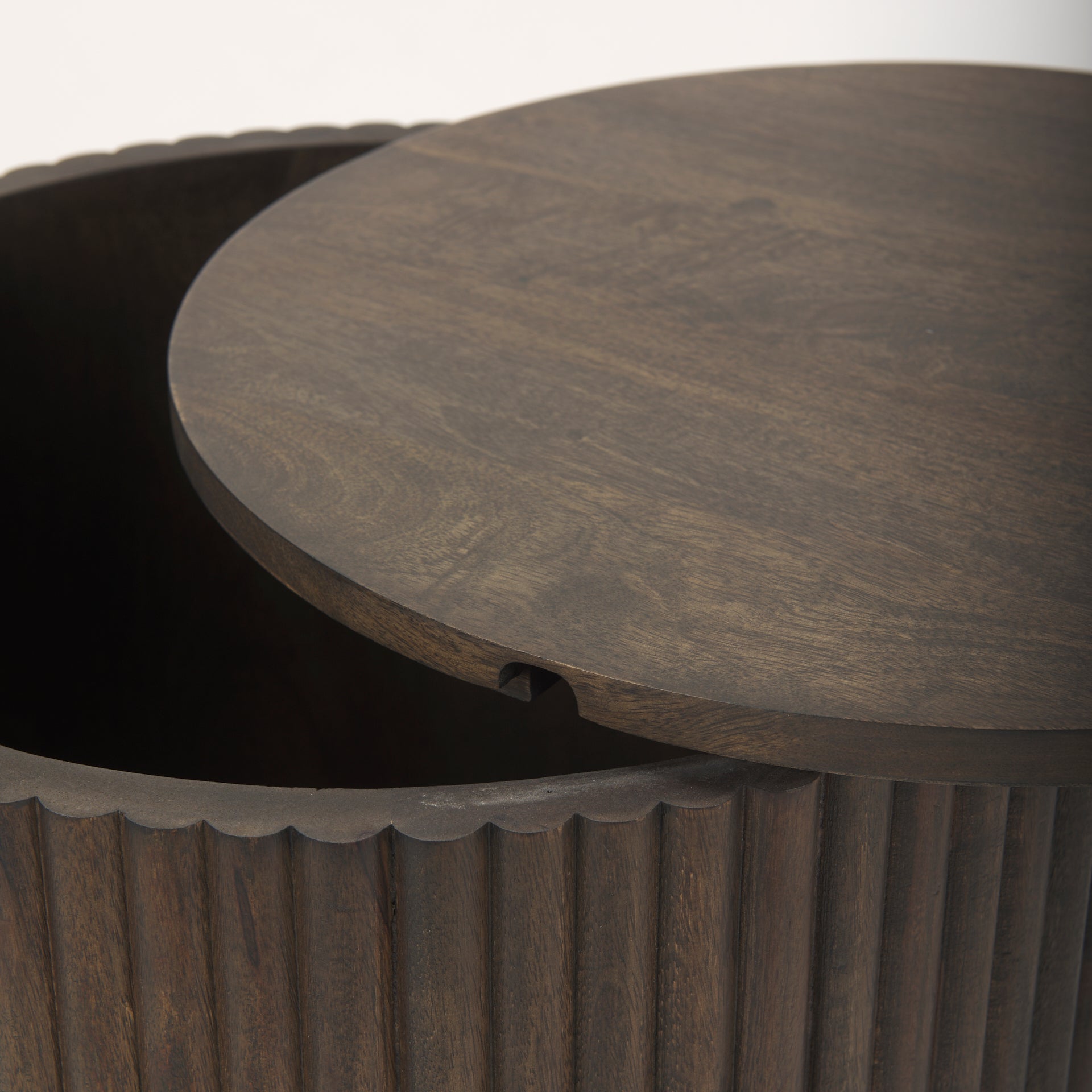 Close-up showing the removable wooden lid slightly ajar on the dark mango wood Eleanor storage side table.