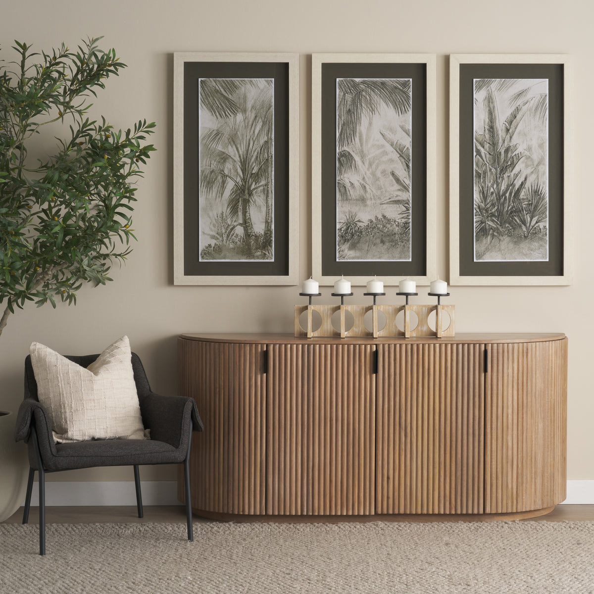 Eleanor light mango wood sideboard styled with an olive tree and earthy decor in a bright living room