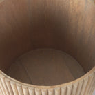 Top-down view inside the empty drum of the Eleanor fluted side table, showcasing its deep, hidden storage capacity.