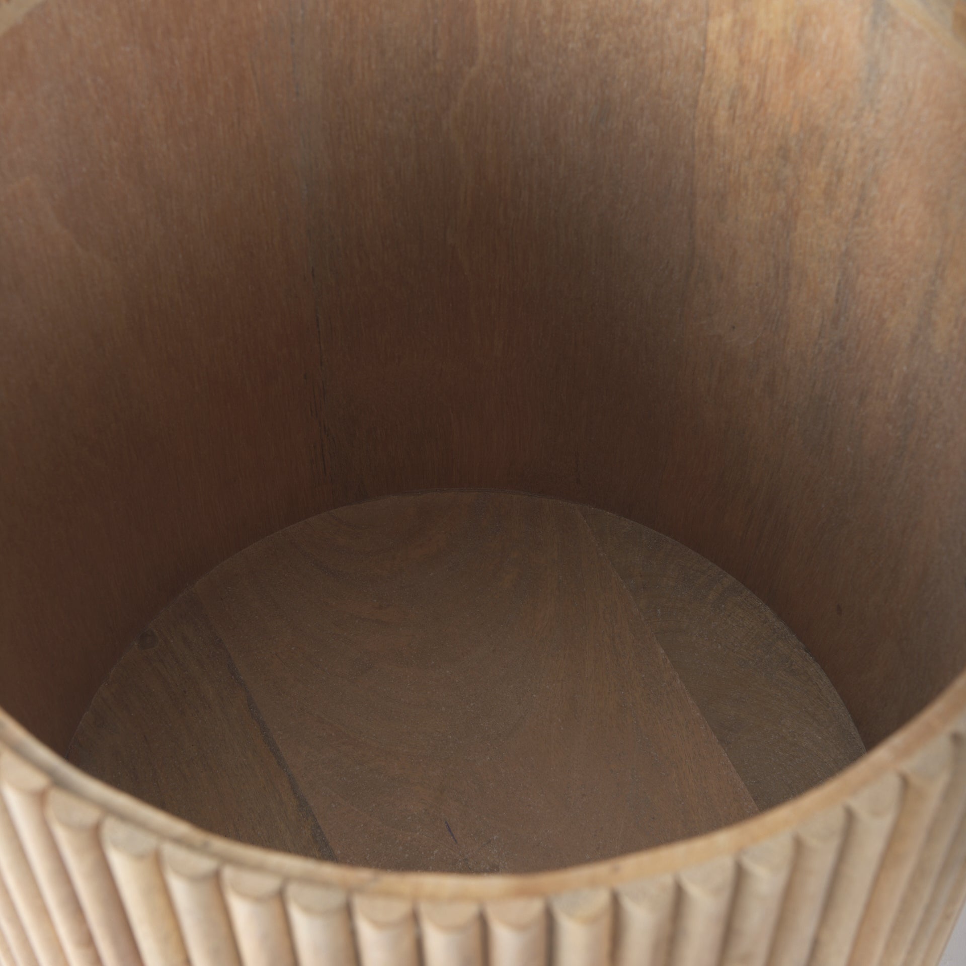 Top-down view inside the empty drum of the Eleanor fluted side table, showcasing its deep, hidden storage capacity.