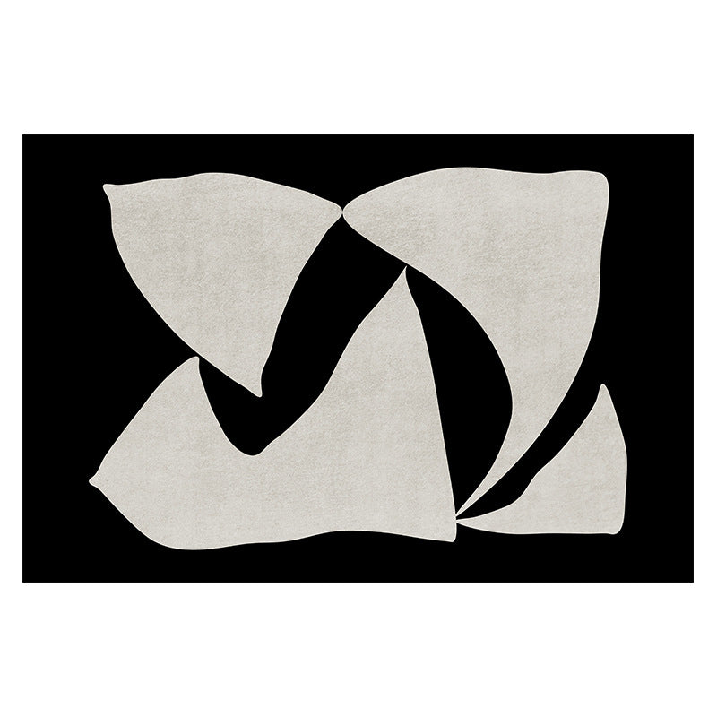 Elegance in Motion Rug with abstract cream shapes on a bold black background