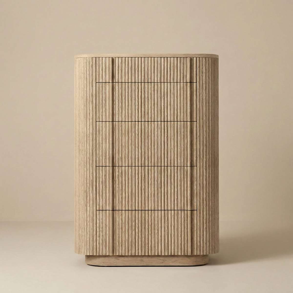 Front view of the Elias tall chest of drawers in natural oak, featuring a curved silhouette and five deep drawers with ribbed wood detail