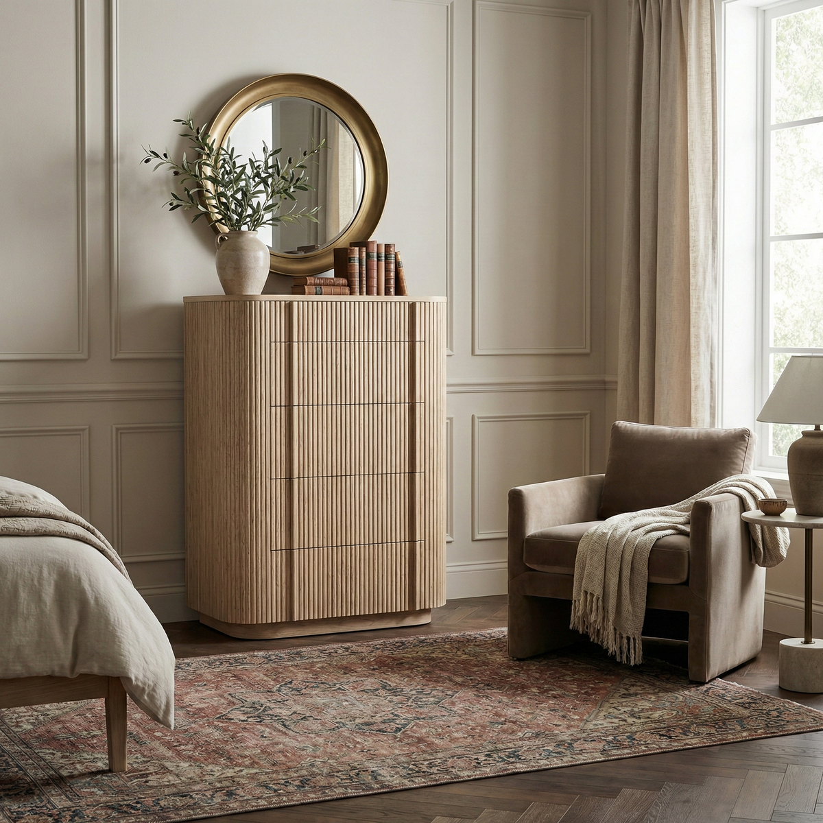 Elias oak tallboy dresser styled in a neutral bedroom with a round mirror, showcasing its vertical fluted texture and space-saving vertical design