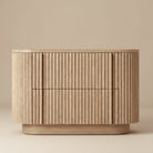 Front view of the Elias Oak Nightstand with two fluted drawers and rounded corners