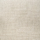 Close-up view of the high-quality cream bouclé fabric used on the Elodie barrel chair, showing its nubby, tactile texture.