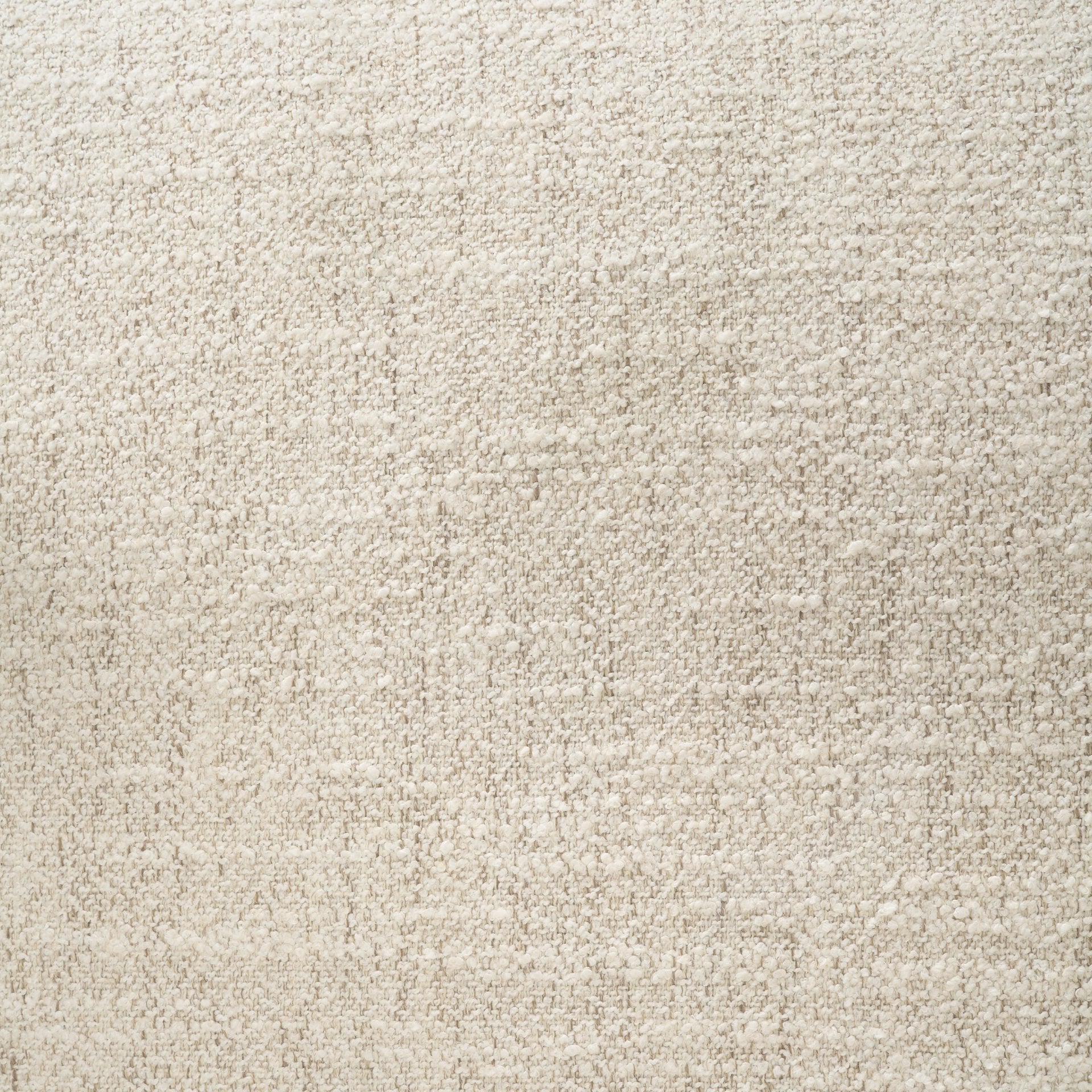 Close-up view of the high-quality cream bouclé fabric used on the Elodie barrel chair, showing its nubby, tactile texture.