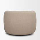 Full back view of the Elodie barrel chair showcasing the seamless dark beige textured upholstery.