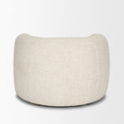 Back view of the Elodie barrel chair showcasing the continuous cream bouclé upholstery.