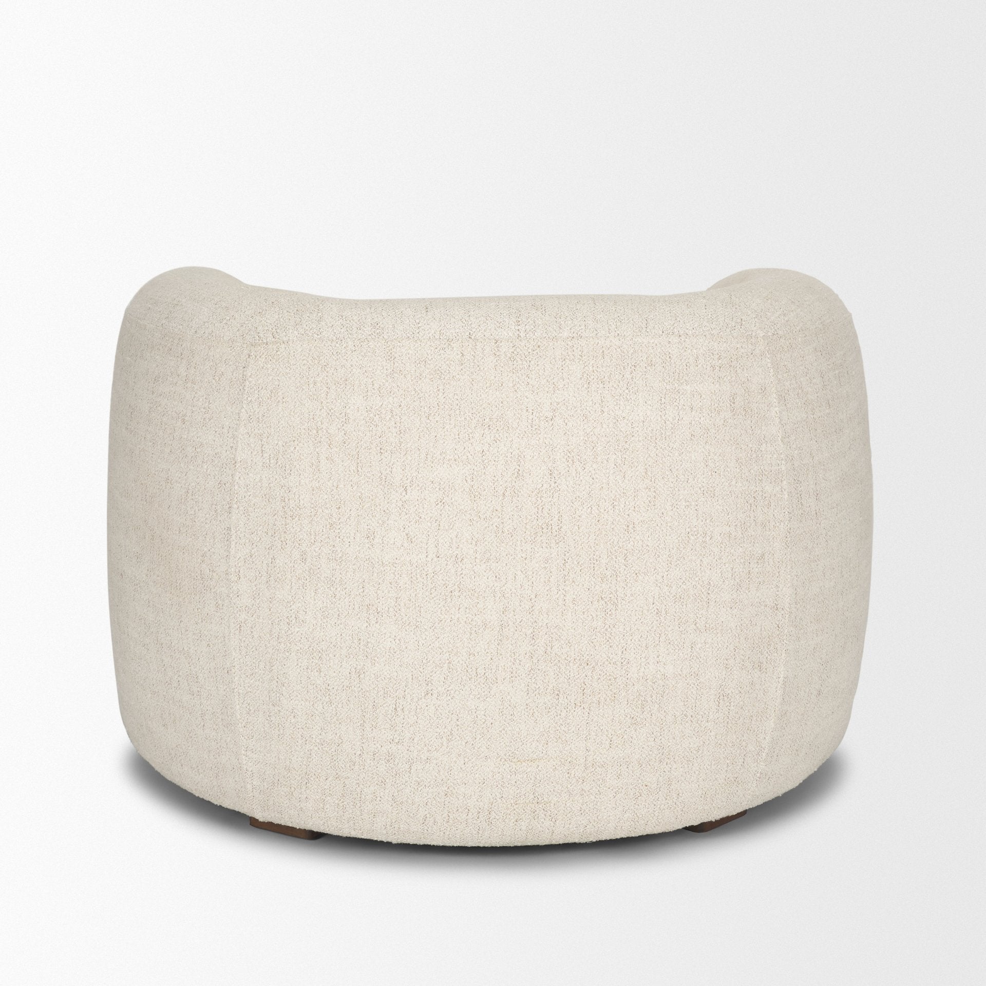 Back view of the Elodie barrel chair showcasing the continuous cream bouclé upholstery.