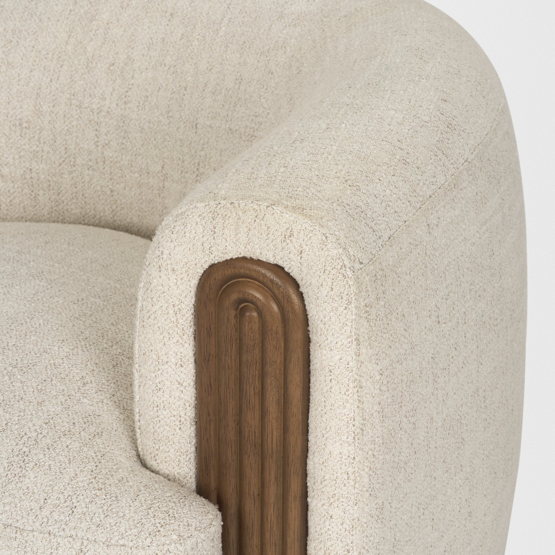 Macro close-up of the Elodie chair's armrest highlighting the deep vertical fluting and warm natural wood grain.