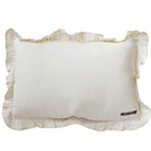White pillow with ruffles edge on a white background