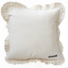 White pillow with ruffles edge on a white background