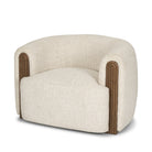 Angled studio view of the Elodie barrel chair showcasing its deep seat and seamless upholstered silhouette.
