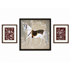 Three framed artworks on a wall, featuring a horse and floral designs.