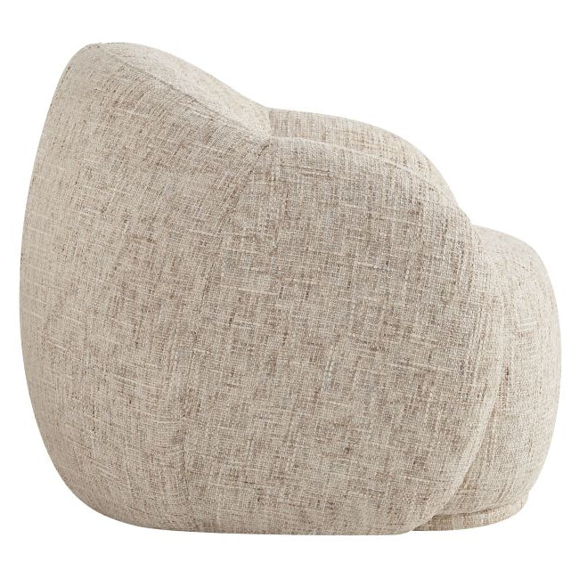 Side view of the Textured Estelle beige accent chair on a white background