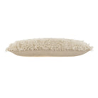 Beige fluffy pillow on a white background