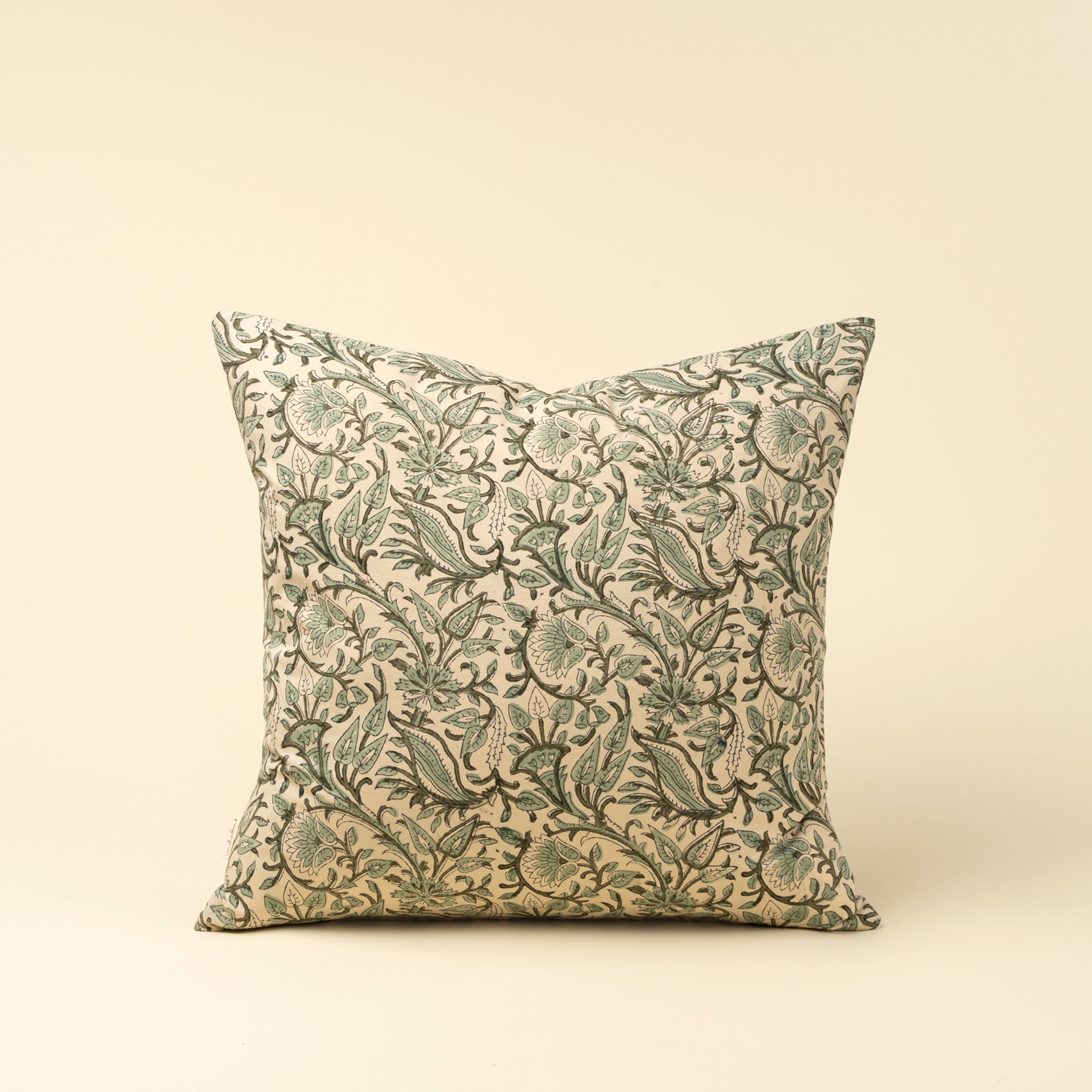 Decorative pillow with floral pattern on a beige background
