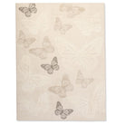Full view of Flutterby Meadow Kids Rug with soft neutral butterflies scattered across a warm ivory background.