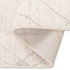 Folded corner of the Harper modern trellis rug showcasing its soft textured surface and durable woven backing