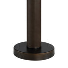 Close up detail of the Harrison table lamp base showing the rich texture of the leather-wrapped stem meeting the bronze metal foot.
