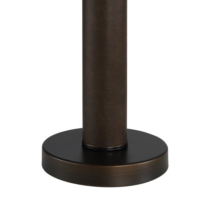 Close up detail of the Harrison table lamp base showing the rich texture of the leather-wrapped stem meeting the bronze metal foot.