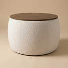 Full view of the Haven Storage Ottoman featuring cream bouclé fabric and a circular walnut wood top.