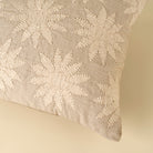 Decorative pillow with floral pattern on a beige background