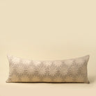Decorative pillow with floral pattern on a beige background