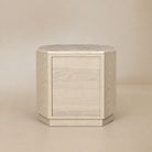 [Hexley White Oak & Travertine Nightstand] Rear view showing the white oak back panel, chamfered corners, travertine top, and recessed plinth base.