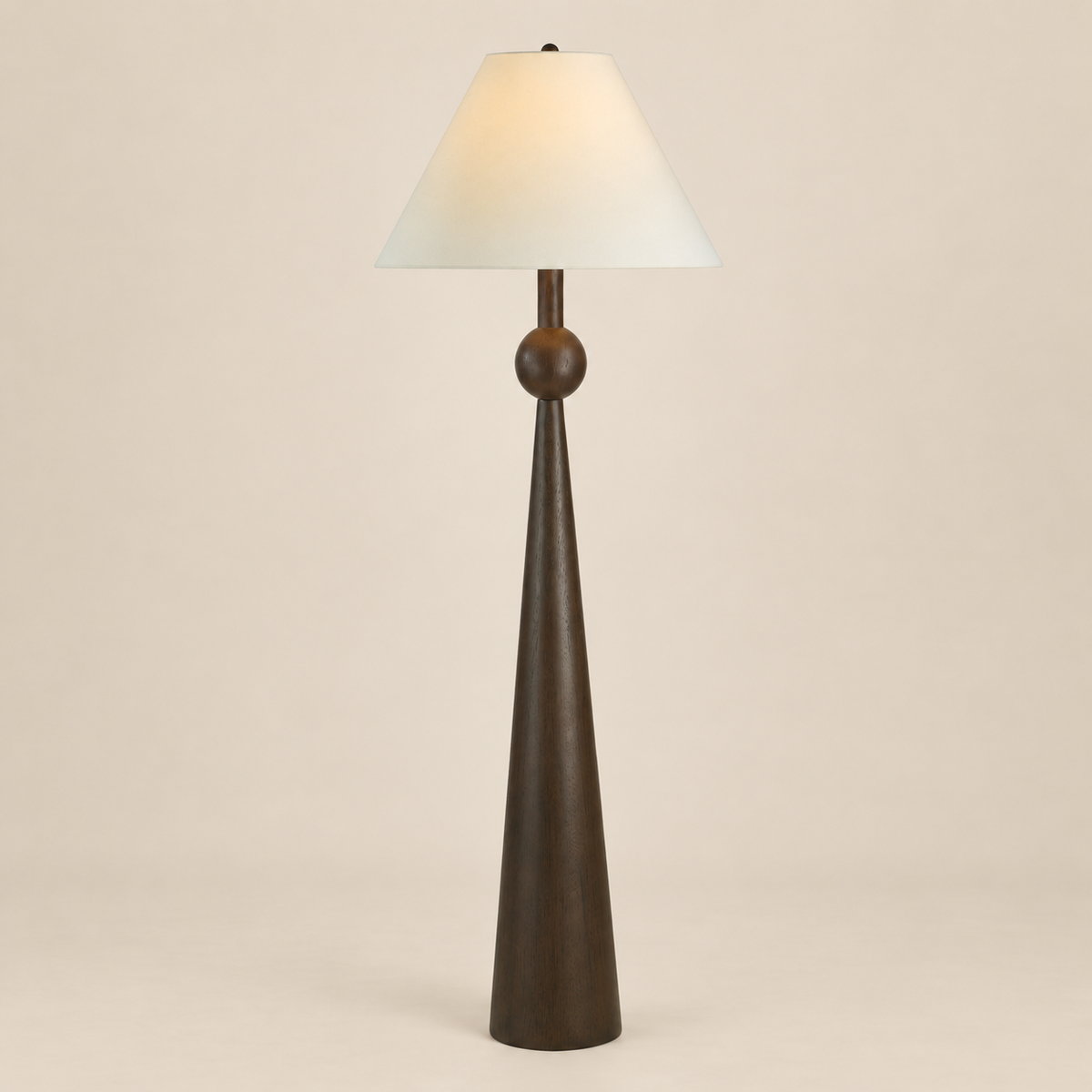 Inez Dark Walnut Floor Lamp featuring a sculptural painted dark walnut resin base and off-white linen shade on a seamless beige studio background.