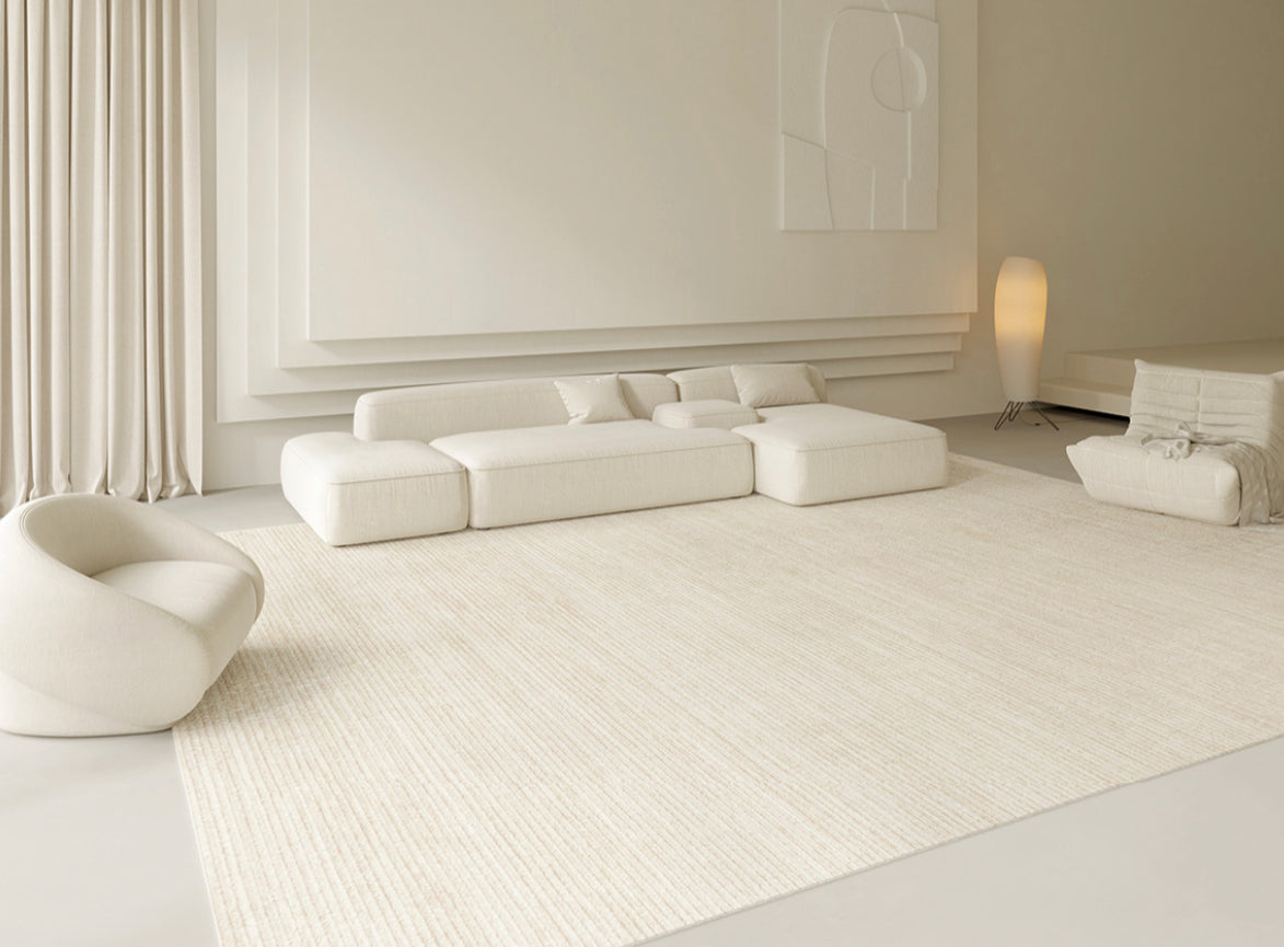 Isabella Rug in a bright neutral living room with low white seating