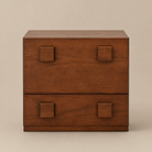 Wooden dresser with four square handles on a beige background