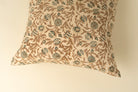 Decorative pillow with floral pattern on a beige background