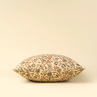 Decorative pillow with floral pattern on a beige background