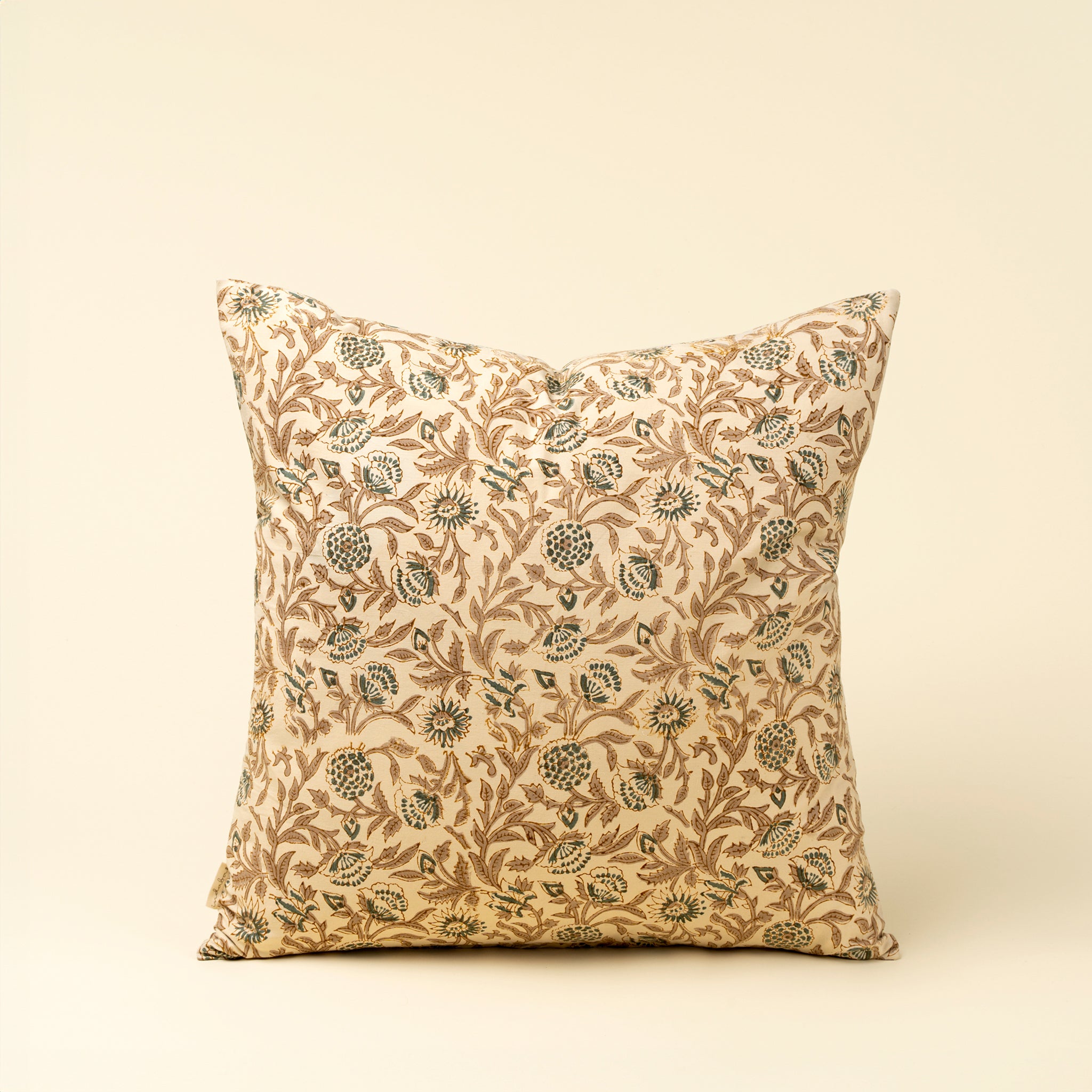 Decorative pillow with floral pattern on a beige background