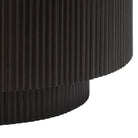 Black cylindrical base with fluted texture on a white background