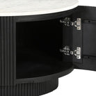 Kaia round black coffee table with open door revealing the hidden storage.