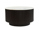 Kaia round black table with a white marble top on a white background