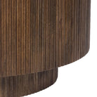 Kaia round wooden side table with fluted base on a white background