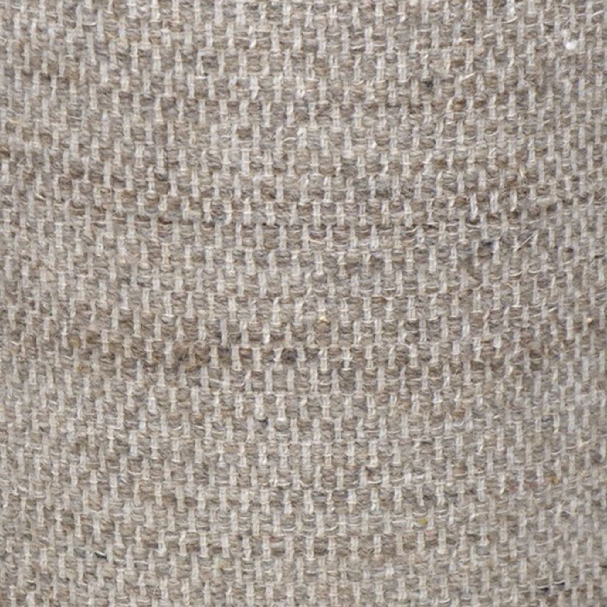 Close-up of a textured beige fabric surface