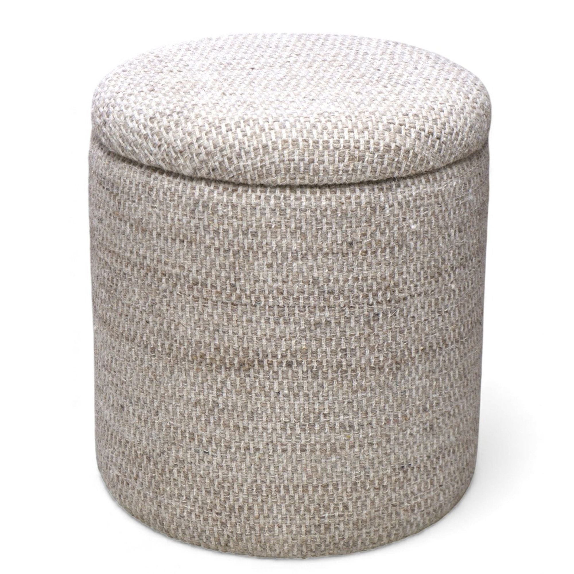 Round storage ottoman with textured fabric on a white background