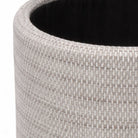 Close-up of a textured gray planter with a black interior.