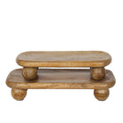 Wooden two-tiered table with round legs on a white background