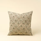 Decorative pillow with a floral pattern on a beige background