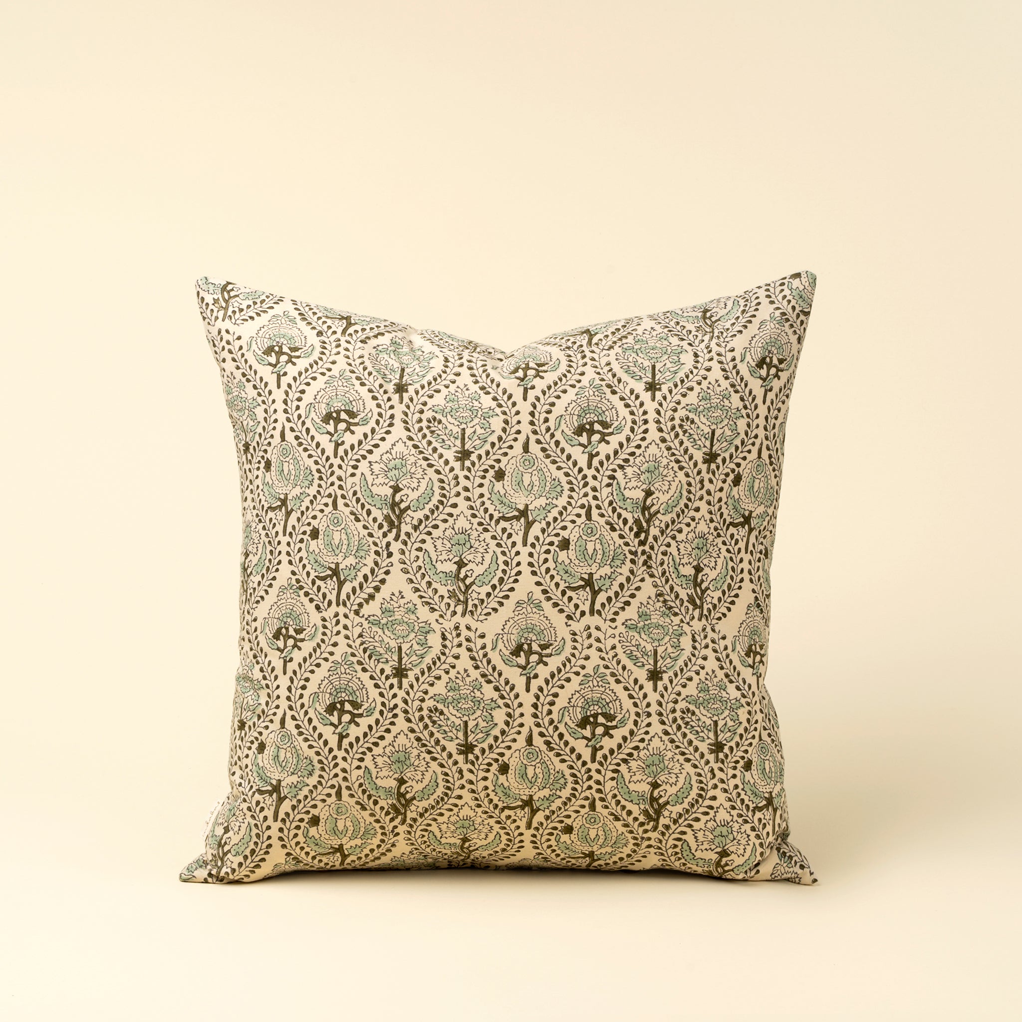 Decorative pillow with a floral pattern on a beige background