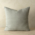 Full front view of the Lina linen pillow featuring a natural raw-edge fringe detail.