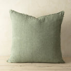 Full front view of the Lina linen pillow featuring a natural raw-edge fringe detail.