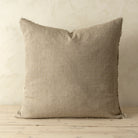 Full front view of the Lina linen pillow featuring a natural raw-edge fringe detail.